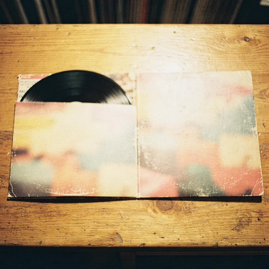 A gatefold vinyl LP lying open on a shop counter