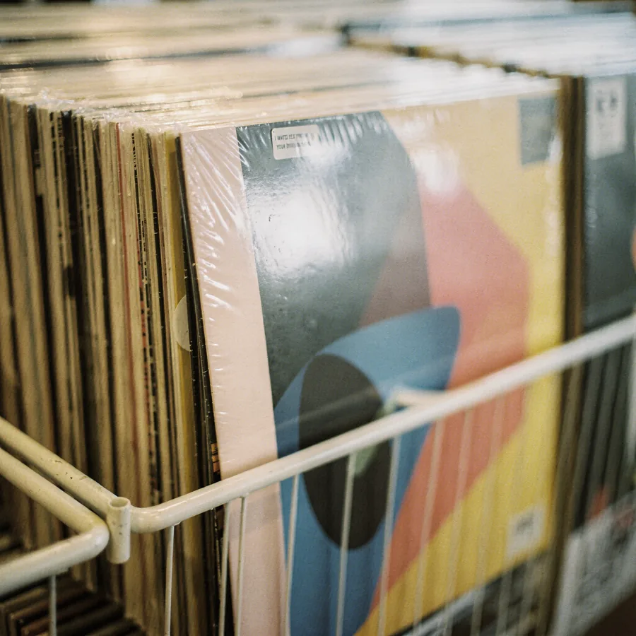 Sealed new vinyl LPs in a retail rack