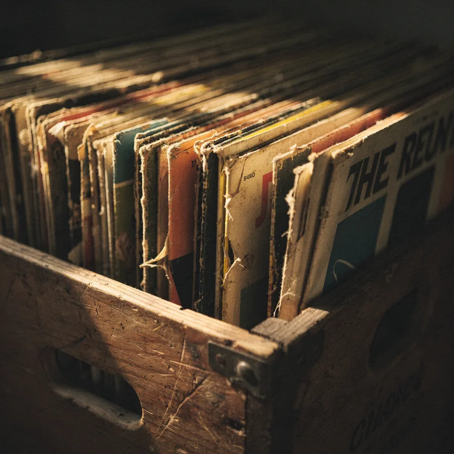 Aged original jazz pressings in a worn wooden crate