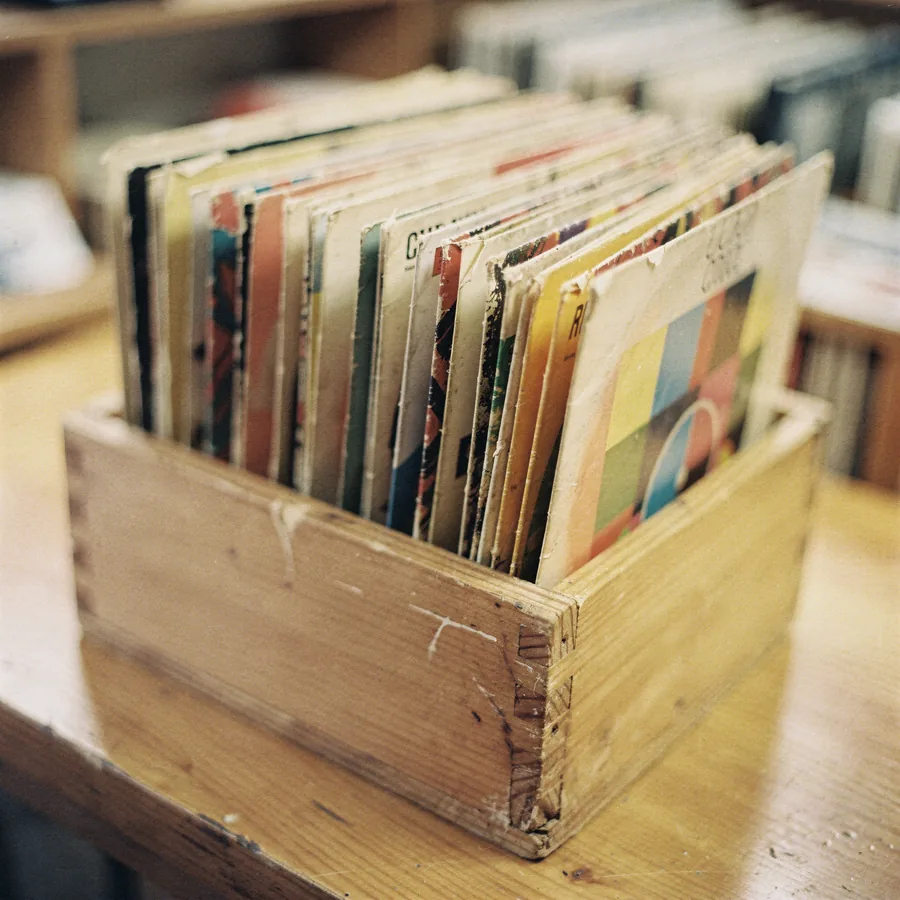 Seven-inch vinyl singles packed upright in a wooden box
